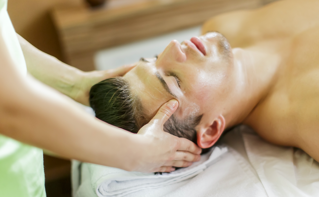 man receiving facial massage griffins house